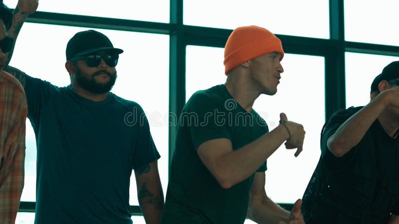 Skilled hipster pose at camera with multicultural friend at building. Hiphop. royalty free stock photo