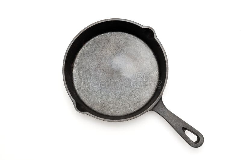 Skillet чугуна варить оборудование жаря изолированную белизну лотка стоковое фото rf
