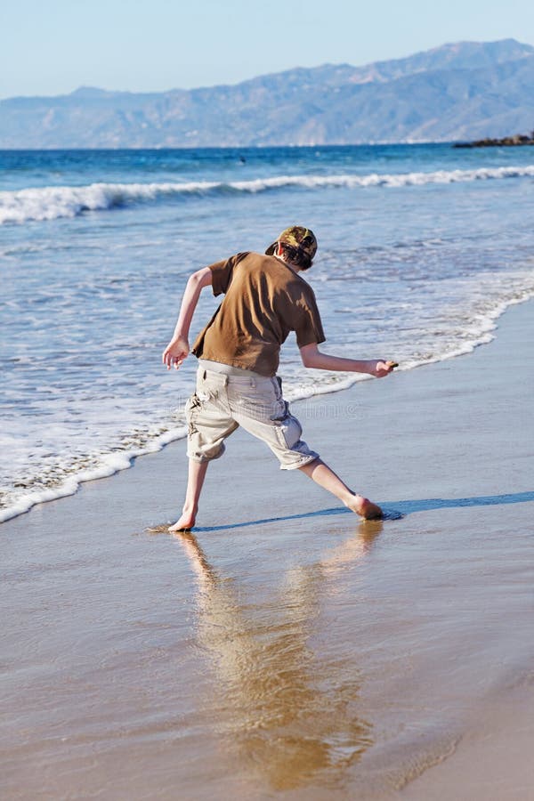 Skimming stones stock image. Image of beach, teenage 19966925