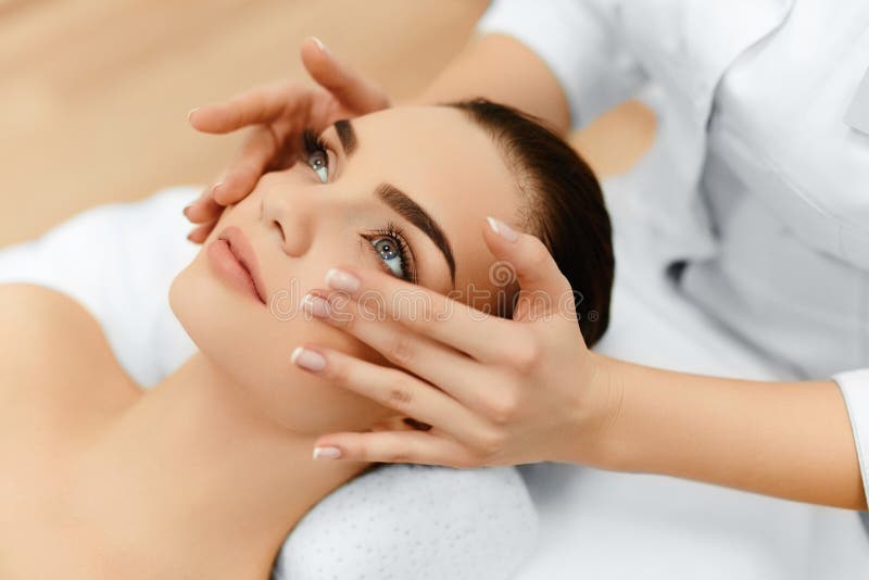 Skin And Body Care. Close-up Of A Young Woman Getting Spa Treatment At Beauty Salon. Spa Face Massage. Facial Beauty Treatment. Spa Salon. Skin And Body Care. Close-up Of A Young Woman Getting Spa Treatment At Beauty Salon. Spa Face Massage. Facial Beauty Treatment. Spa Salon.