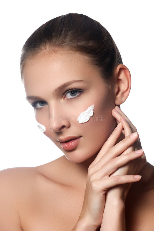 Skin Care Lady Putting Face Cream. Attractive Brunette Girl on W Stock