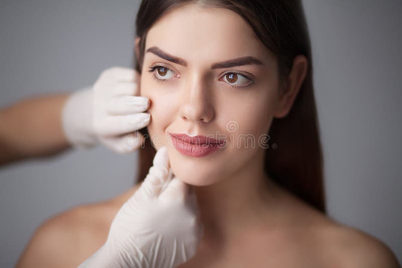 Skin care woman removing face makeup - skin care concept / photo. Brunette, beauty.