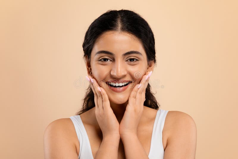 Profile of Indian woman smiling and touching her hair Stock Photo - Alamy