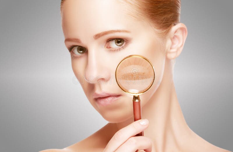 Concept skincare. Skin of beauty young woman with magnifier before and after the procedure on a white background. Concept skincare. Skin of beauty young woman with magnifier before and after the procedure on a white background