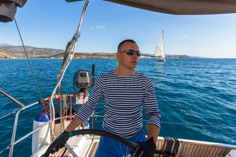 Skipper at the Helm Controls of a Sailing Yacht. Sport. Stock Image Image of master, compass