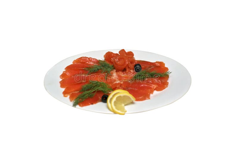 Skivad röd fisk med oliv och citronen på en vit platta, isolat arkivbild Skivad röd fisk med oliv och citronen på en vit platta, isolat arkivbild