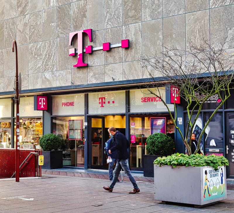 Den Haag, Netherlands - November 01 2021: a store of t mobile on main street specialised in mobile phones and smartphones. Den Haag, Netherlands - November 01 2021: a store of t mobile on main street specialised in mobile phones and smartphones