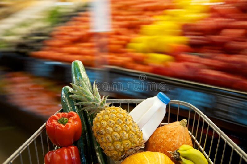 Grocery shopping cart with blurry background. Grocery shopping cart with blurry background