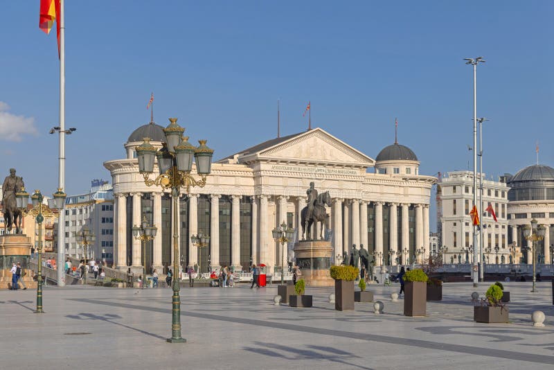 Skopje, North Macedonia - October 23, 2023: Archaeological Museum Building and Equestrian Statue Monument Goce Delcev Historic Landmark at Capital City Central Square SunnyDay. Skopje, North Macedonia - October 23, 2023: Archaeological Museum Building and Equestrian Statue Monument Goce Delcev Historic Landmark at Capital City Central Square SunnyDay