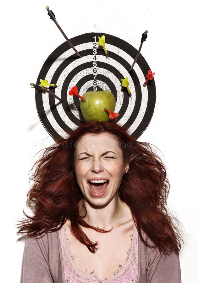 Crying girl portrait with apple, darts and arrows. This image has attached release. Crying girl portrait with apple, darts and arrows. This image has attached release.