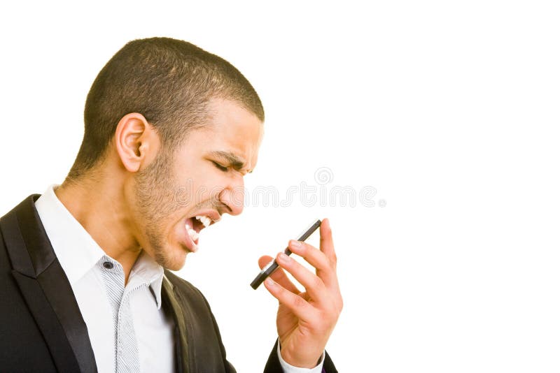 Young business man screaming into his mobile phone. Young business man screaming into his mobile phone
