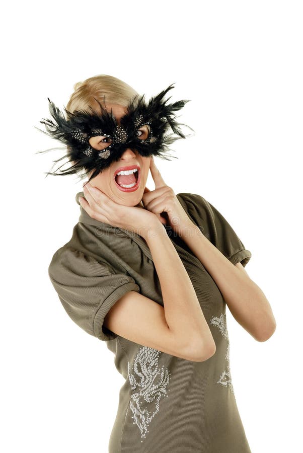 Young attractive female blonde screaming with mask over her face. Young attractive female blonde screaming with mask over her face