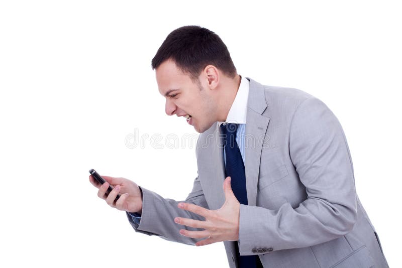 Angry business man screaming at the phone, over white. Angry business man screaming at the phone, over white