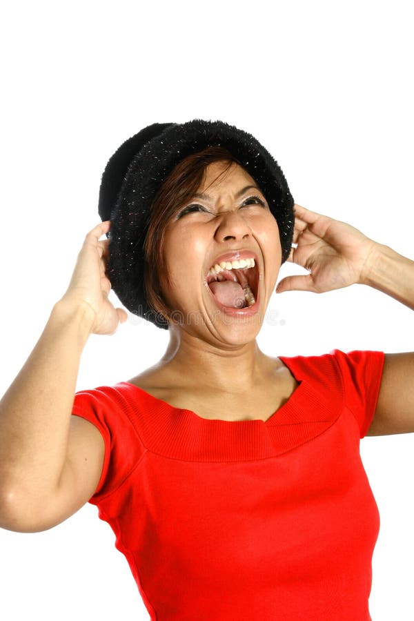 Young Asian female screaming at the top of her voice, showing her emotion of anger and frustration. Young Asian female screaming at the top of her voice, showing her emotion of anger and frustration.