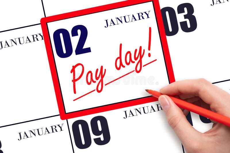 2nd day of January. Hand writing text PAY DATE on calendar date January 2 and underline it. Payment due date. Reminder concept of payment. Winter month, day of the year concept. 2nd day of January. Hand writing text PAY DATE on calendar date January 2 and underline it. Payment due date. Reminder concept of payment. Winter month, day of the year concept.