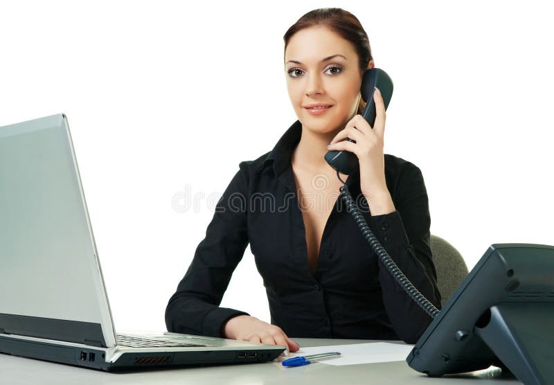 Skrivbordtelefonreceptionist som ler genom att använda barn arkivbild