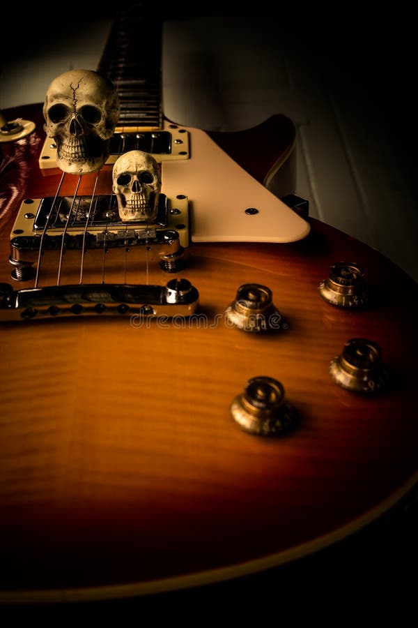 Skull and electric guitar stock photo. Image of skeleton 63331632