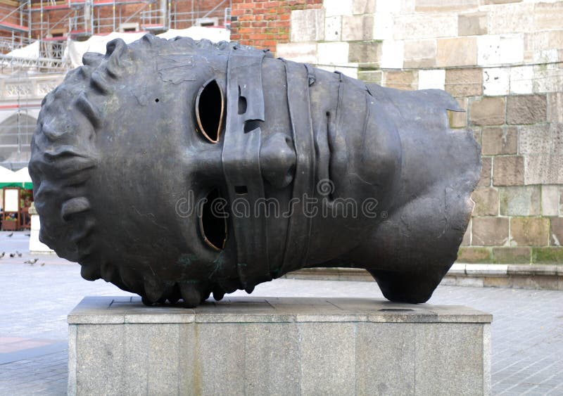 CRACOW - JUNE 8: Sculpture by Igor Mitoraj Eros Bendato on the Main Square on June 8, 2010 in Cracow. Poland. CRACOW - JUNE 8: Sculpture by Igor Mitoraj Eros Bendato on the Main Square on June 8, 2010 in Cracow. Poland