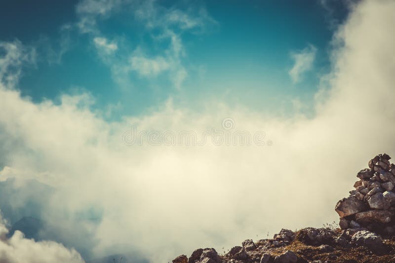 Sky Clouds on Mountain summit with stones hiking route