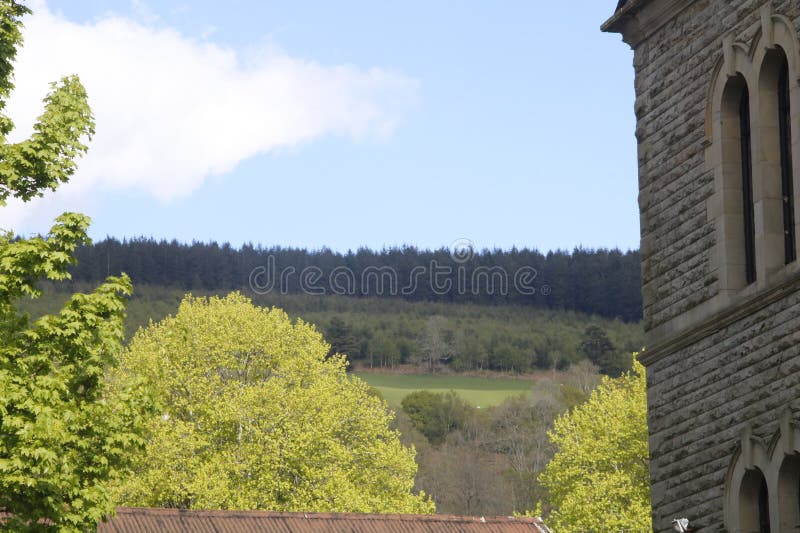 Sky mountain trees and chaple royalty free stock images