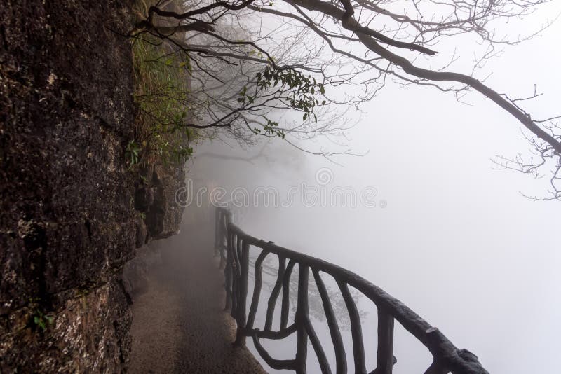 Sky walk at Tianmen Mountain vanishing in heavy mist, Zhangjiajie, China. Sky walk at Tianmen Mountain vanishing in very heavy mist, fog or inverted cloud royalty free stock photo Sky walk at Tianmen Mountain vanishing in heavy mist, Zhangjiajie, China. Sky walk at Tianmen Mountain vanishing in very heavy mist, fog or inverted cloud royalty free stock photo