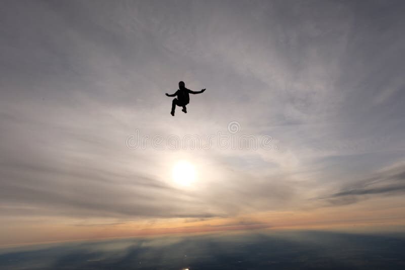 Skydiving. A sunset jump. Skydive is over the sun.