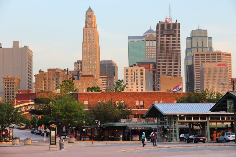 KANSAS CITY, USA - JUNE 25, 2013: People walk in downtown Kansas City, Missouri. Kansas City is the 30th largest metropolitan area in the USA with population of 2,393,623. KANSAS CITY, USA - JUNE 25, 2013: People walk in downtown Kansas City, Missouri. Kansas City is the 30th largest metropolitan area in the USA with population of 2,393,623