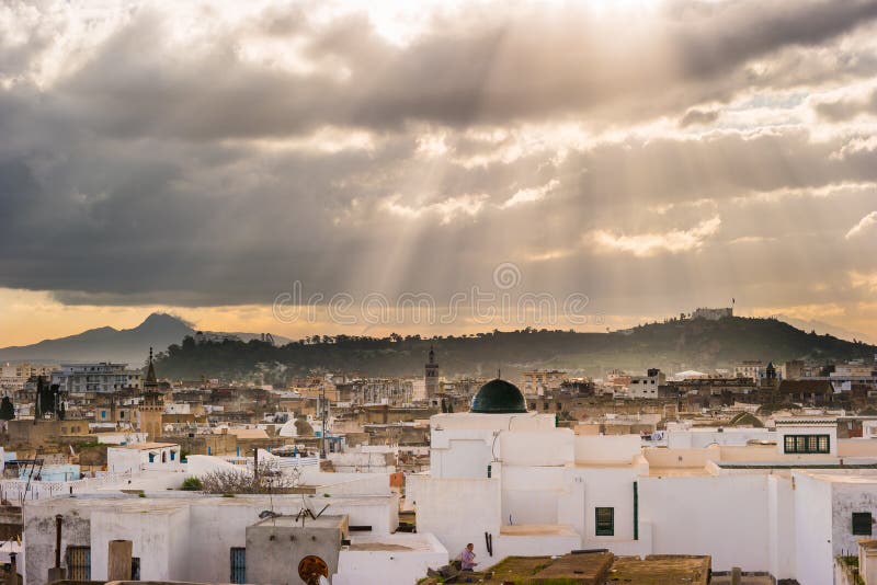 Skyline of Tunis. Traditional architecture in cityscape at dawn with dramatic sunlight. Tunisia, North africa. Skyline of Tunis. Traditional architecture in cityscape at dawn with dramatic sunlight. Tunisia, North africa.