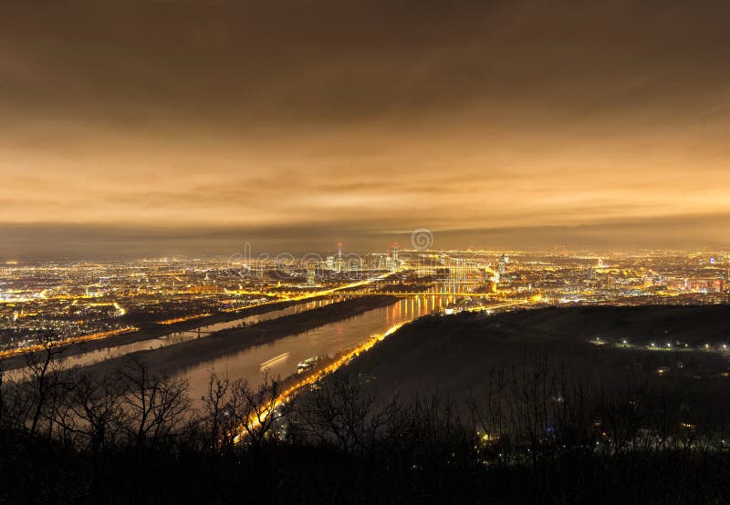 Skyline of Vienna and Danube at night - Viewpoint Leopoldsberg stock photography
