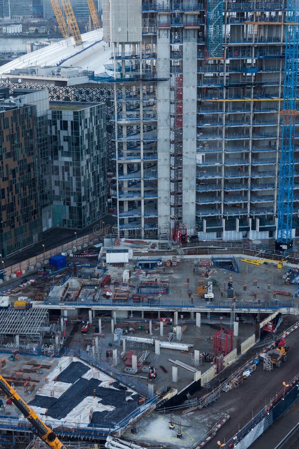 Skyscraper construction building site in Lonon Docklands. Top aerial view on fundaments.