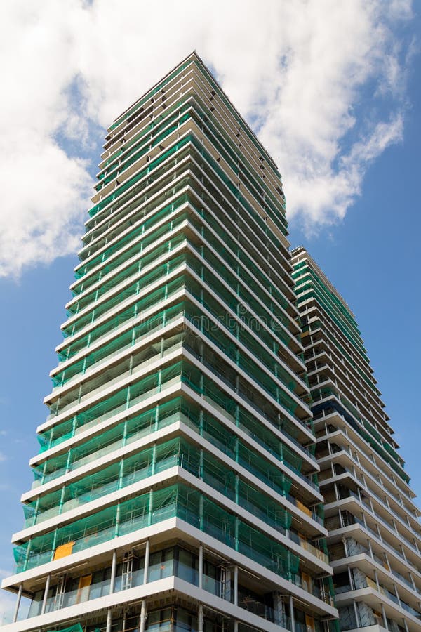 Skyscraper construction site with blue clear sky copy space background