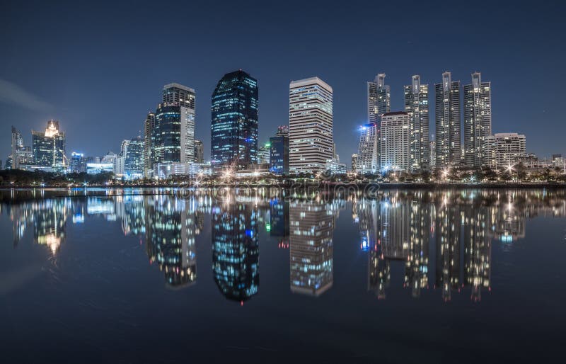 Benjakiti Park Lake Reflection of Skyscrapers at Night in Bangkok, Thailand. Benjakiti Park Lake Reflection of Skyscrapers at Night in Bangkok, Thailand