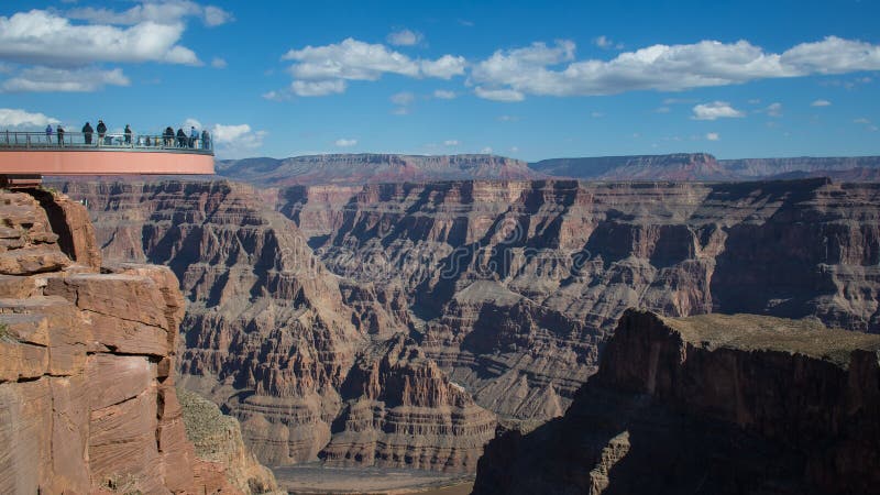 Side view of the Skywalk near Eagle point, in Grand Canyon, Arizona. Sunny day with cloud. Side view of the Skywalk near Eagle point, in Grand Canyon, Arizona. Sunny day with cloud.