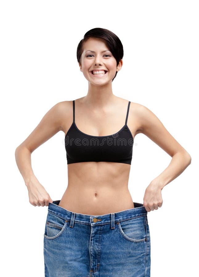 Slanke vrouw die grote jeans draagt royalty-vrije stock foto Slanke vrouw die grote jeans draagt royalty-vrije stock foto