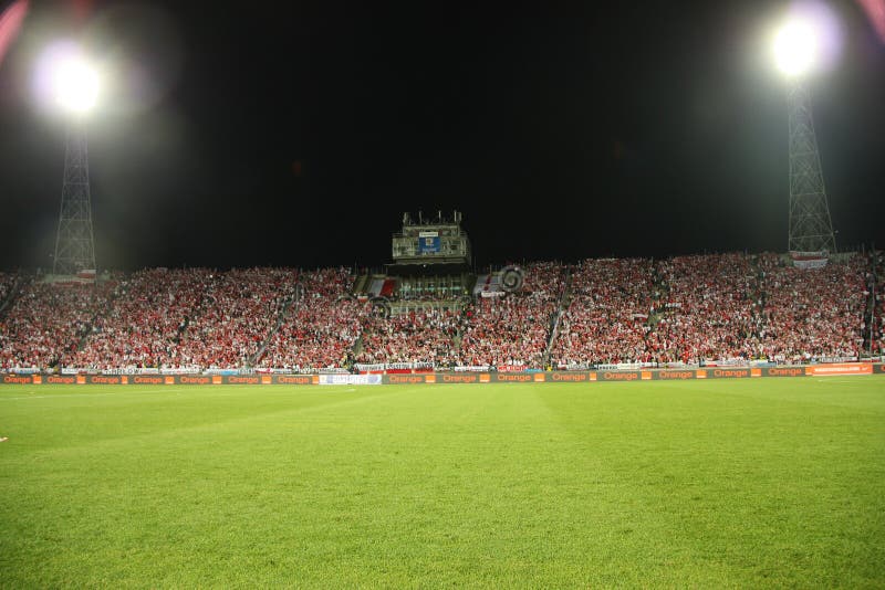 Night image of the Slaski Stadium before the 2010 FIFA World Cup qualification match between Poland and Northern Ireland on September 5, 2009 in Chorzow, Poland. Silesian Stadium (Polish: Stadion Śląski) is a sport stadium located between Chorzów and Katowice in Poland. In 1993, the stadium was designated as the official home stadium of the Polish national football team. In the 1990s, the stadium was converted to an all-seater stadium, reducing the capacity to 47,246. Currently, there are plans to expand its capacity to 55.211 and to construct a roof over the stadium (claimed to become the largest in the world, 43,000 m2). Night image of the Slaski Stadium before the 2010 FIFA World Cup qualification match between Poland and Northern Ireland on September 5, 2009 in Chorzow, Poland. Silesian Stadium (Polish: Stadion Śląski) is a sport stadium located between Chorzów and Katowice in Poland. In 1993, the stadium was designated as the official home stadium of the Polish national football team. In the 1990s, the stadium was converted to an all-seater stadium, reducing the capacity to 47,246. Currently, there are plans to expand its capacity to 55.211 and to construct a roof over the stadium (claimed to become the largest in the world, 43,000 m2).