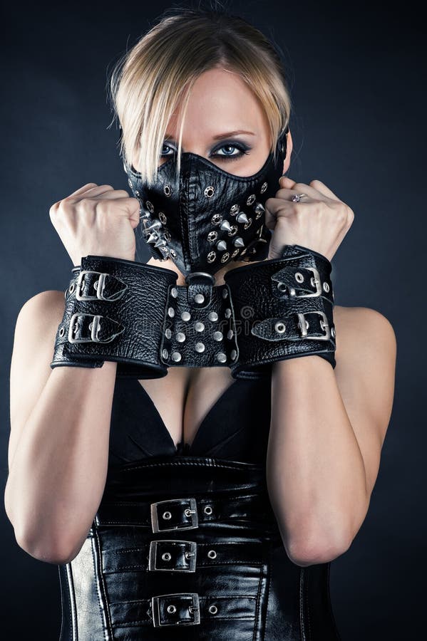 Slave in a mask with spikes