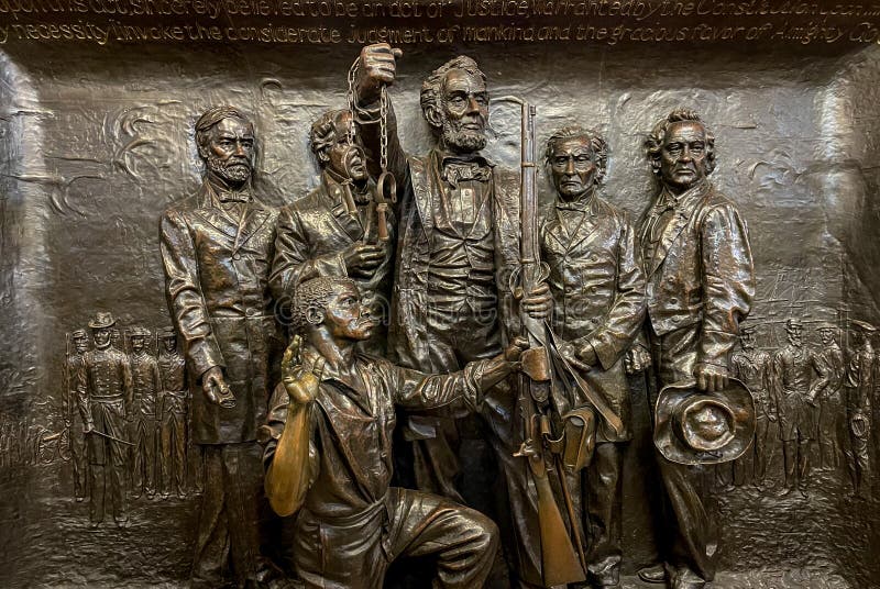 The Emancipation Panel in the Soldiers` and Sailors` Monument in Cleveland, Ohio The Emancipation Panel represents two important pieces of federal legislation: the Emancipation Proclamation and the creation of the United States Colored Troops. Behind Abraham Lincoln stand four major figures from Ohio who fought for emancipation: Joshua R. Giddings, Benjamin Wade, Salmon P. Chase, and John Sherman. Abraham Lincoln, who stands at the center, is seen handing a union rifle to an African-American man named Dan R. Field who is seen being sworn into the Army. The Emancipation Panel in the Soldiers` and Sailors` Monument in Cleveland, Ohio The Emancipation Panel represents two important pieces of federal legislation: the Emancipation Proclamation and the creation of the United States Colored Troops. Behind Abraham Lincoln stand four major figures from Ohio who fought for emancipation: Joshua R. Giddings, Benjamin Wade, Salmon P. Chase, and John Sherman. Abraham Lincoln, who stands at the center, is seen handing a union rifle to an African-American man named Dan R. Field who is seen being sworn into the Army.