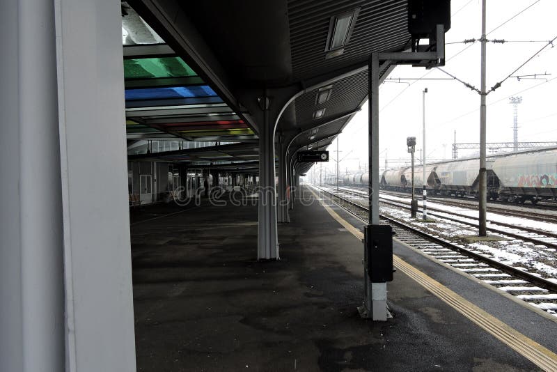 Slavonski Brod, Croatia 1/31/2019: Train station covered with snow with foggy cold day. Slavonski Brod, Croatia 1/31/2019: Train station covered with snow with foggy cold day.