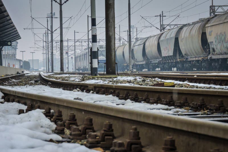 Slavonski Brod, Croatia 1/31/2019: Train station covered with snow with foggy cold day. Slavonski Brod, Croatia 1/31/2019: Train station covered with snow with foggy cold day