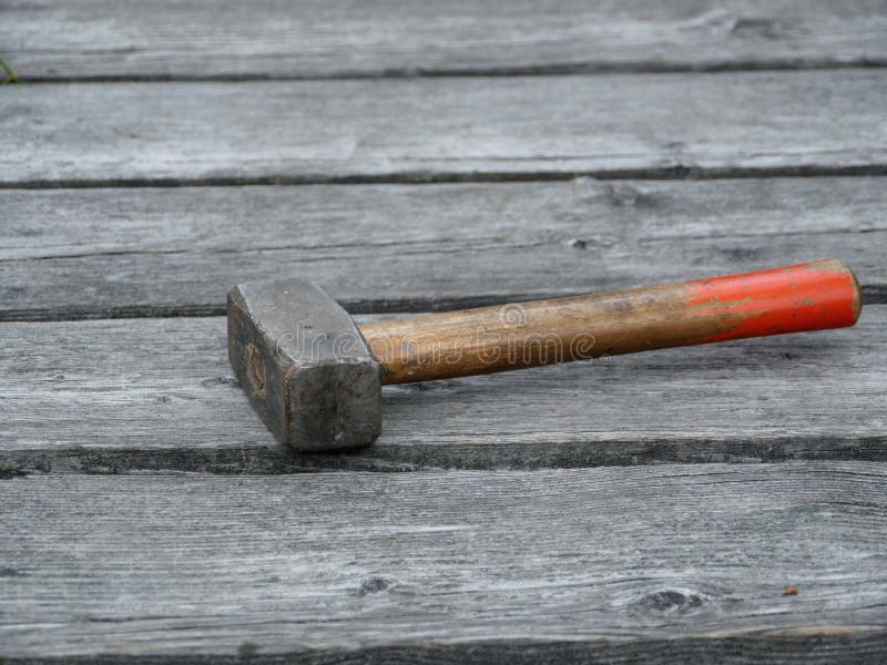 Sledgehammer on the old boards stock image Sledgehammer on the old boards stock image