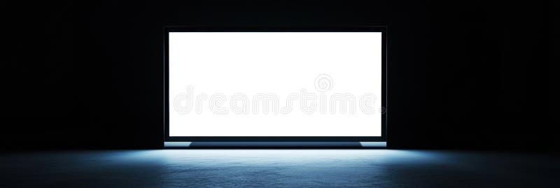 Sleek desktop monitor with bright white screen in minimalistic workspace at night royalty free stock images