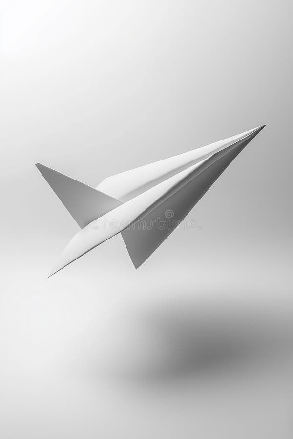 A Sleek Paper Airplane Soaring Against a Minimalist Gray Background in