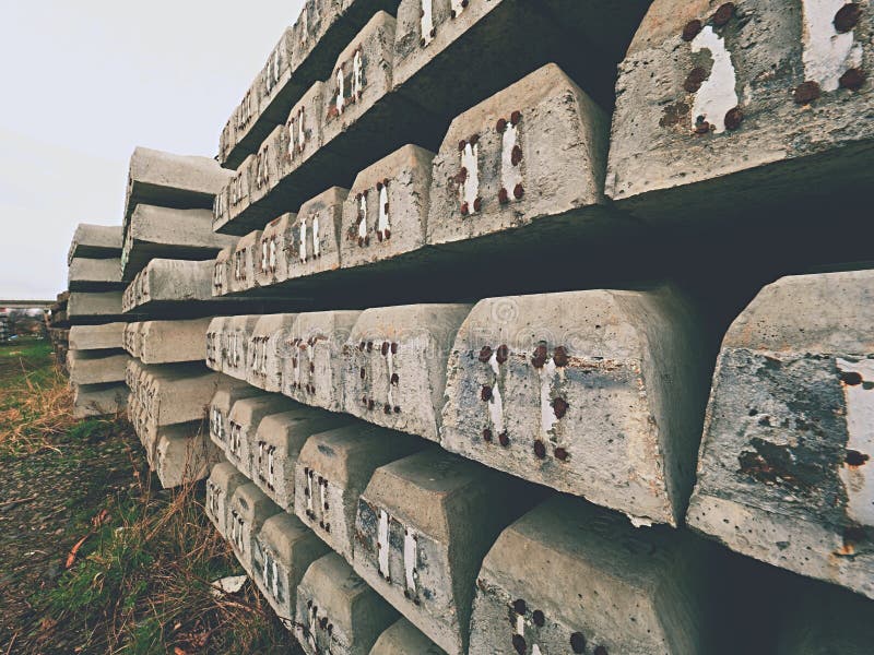 Sleepers production. Concrete casting and assembly. New concrete railway ties stored stock photos Sleepers production. Concrete casting and assembly. New concrete railway ties stored stock photos