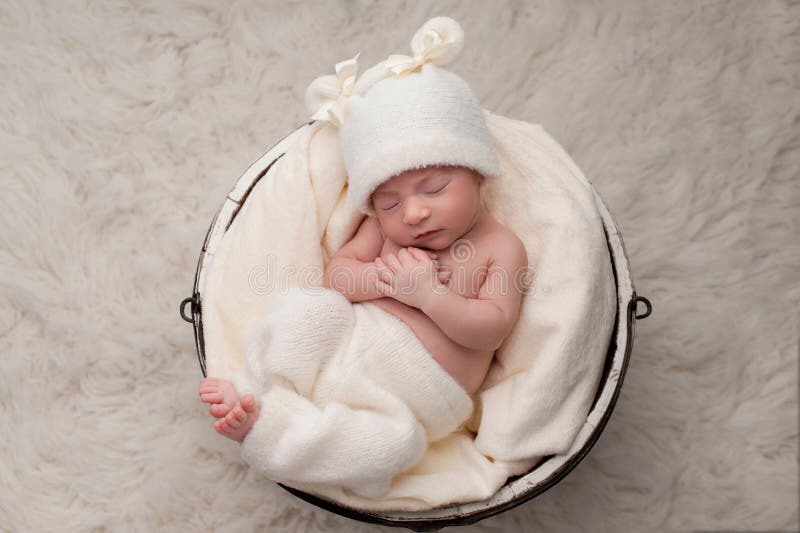 Sleeping Baby Girl in Bucket royalty free stock photo Sleeping Baby Girl in Bucket royalty free stock photo