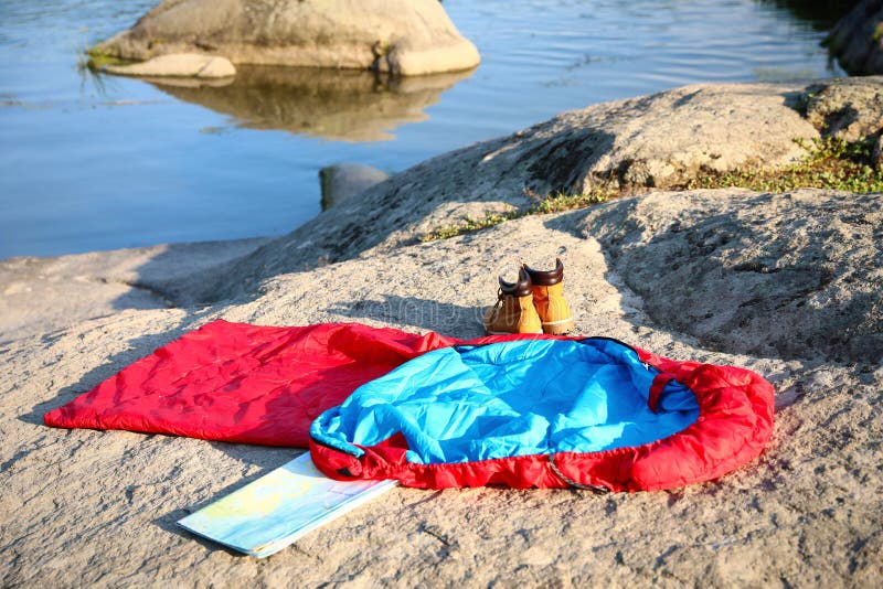 Sleeping Bag, Boots and Map on Sunny Day Stock Image Image of