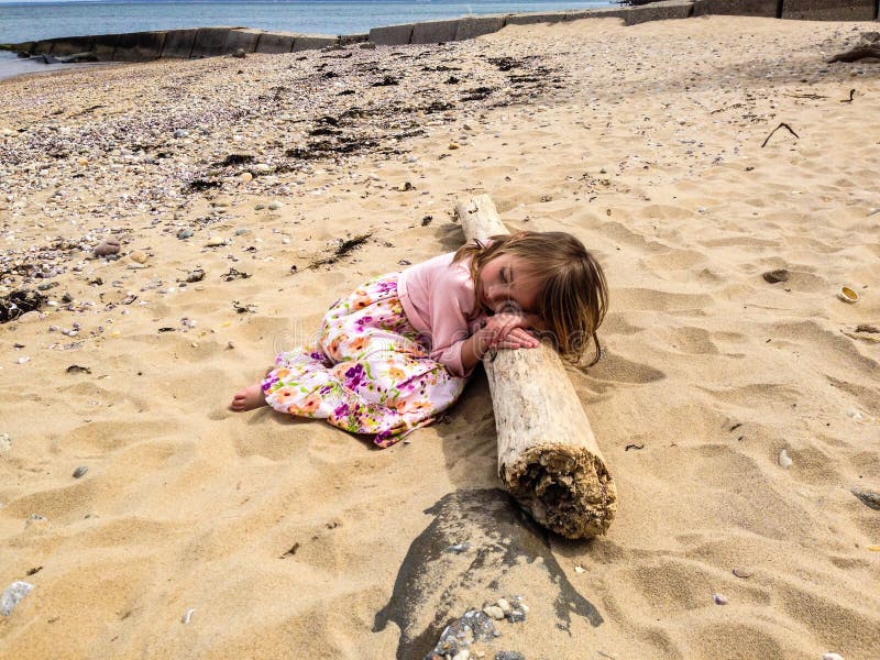 137 Little Girl Sleeping Beach Stock Photos Free & RoyaltyFree Stock