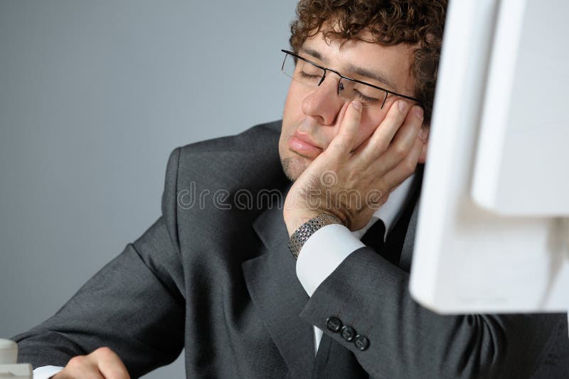 Horizontal image of young sleeping businessman