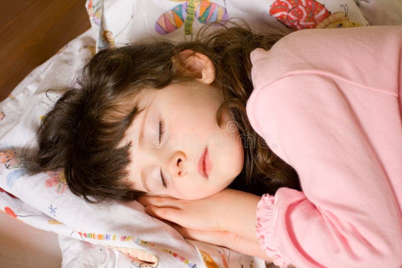 Portrait of cute caucasian girl child sleeping in her bed. Portrait of cute caucasian girl child sleeping in her bed