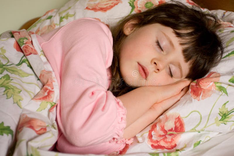 Portrait of cute caucasian girl child sleeping in her bed. Portrait of cute caucasian girl child sleeping in her bed