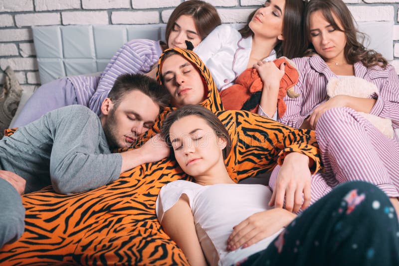Sleeping Group of Young People on the Bed. Stock Photo Image of hangover, home 155365282